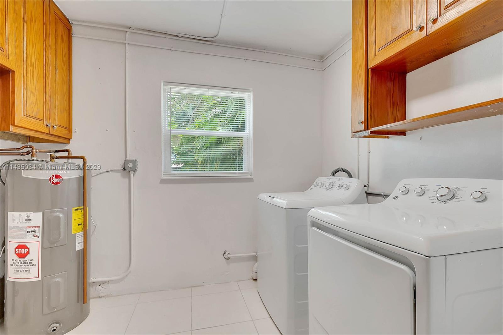 1023 Northwest 3rd Avenue Homestead, FL 33030 - Photo 19 of 32 a utility room with dryer and washer