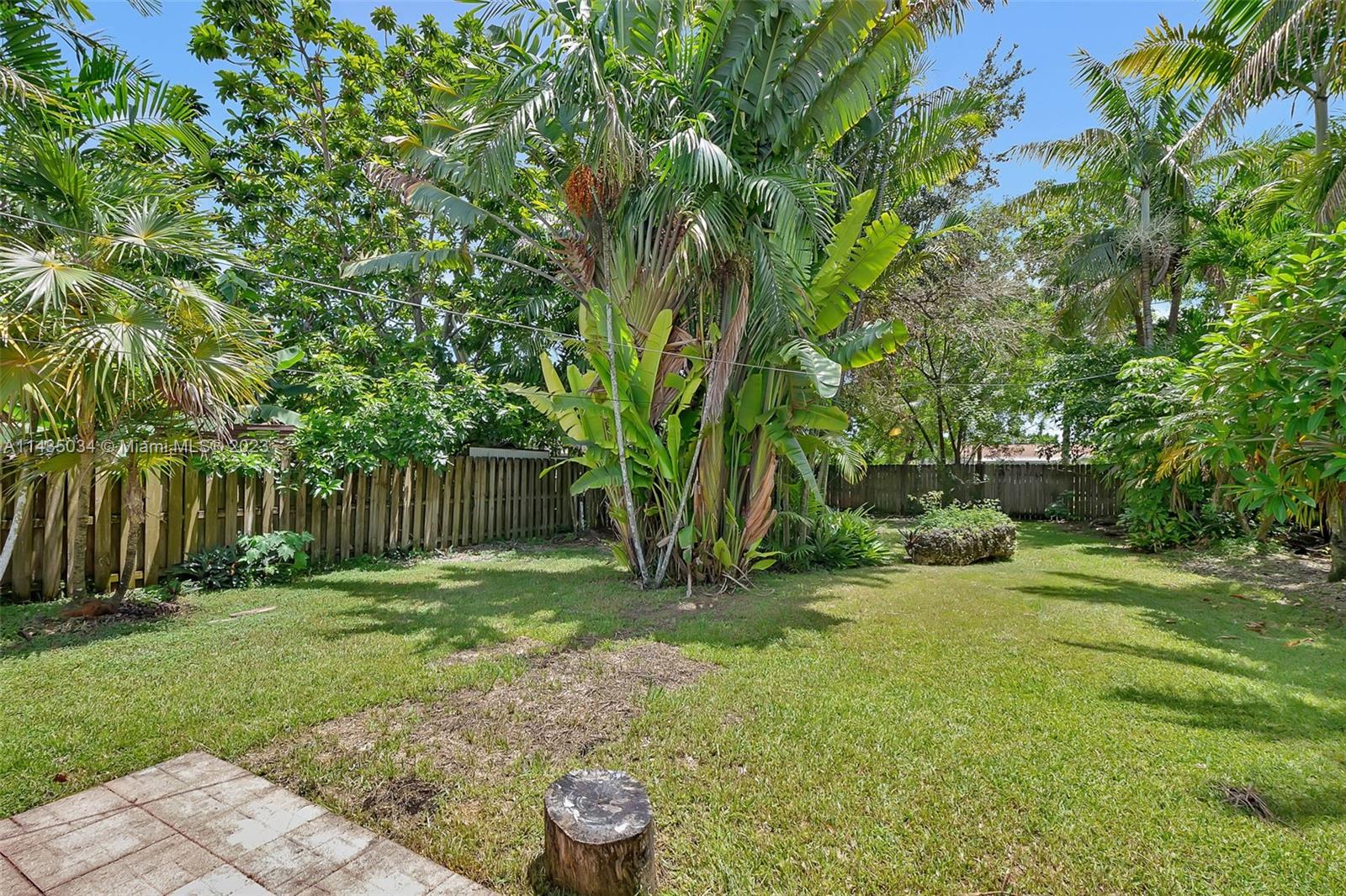 1023 Northwest 3rd Avenue Homestead, FL 33030 - Photo 22 of 32 a backyard of a house with lots of green space