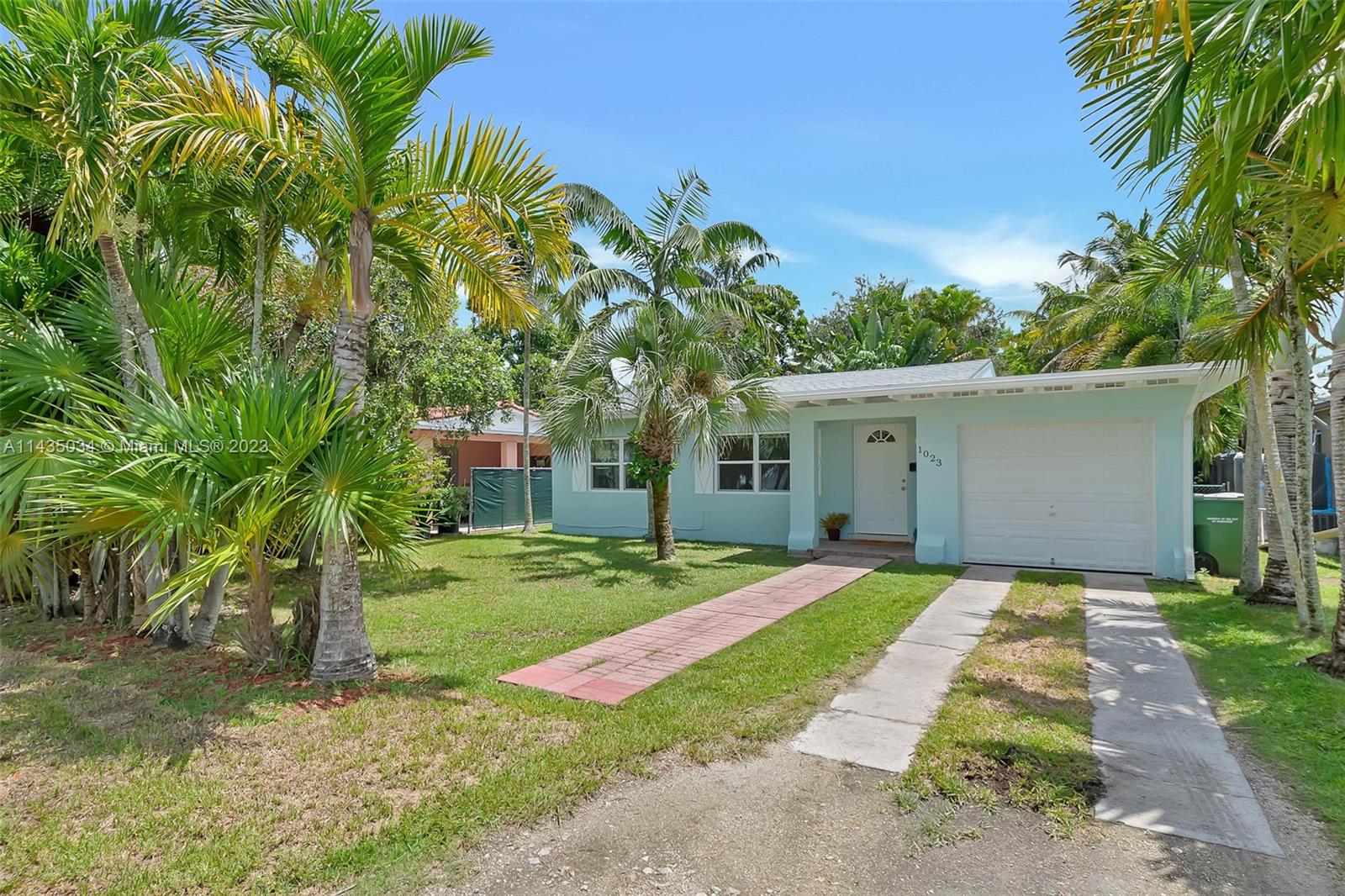 1023 Northwest 3rd Avenue Homestead, FL 33030 - Photo 25 of 32 a front view of house with yard and green space