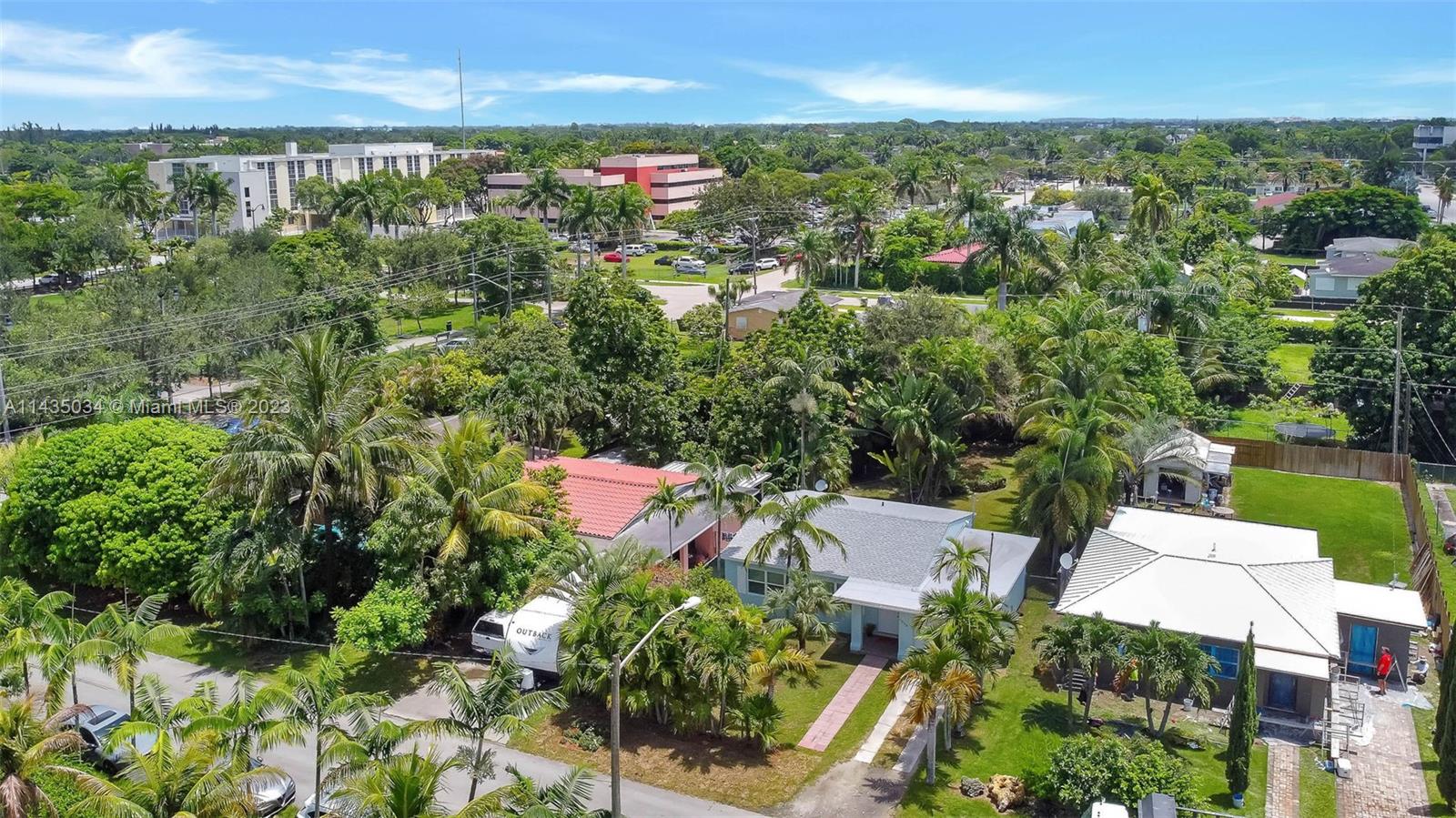 1023 Northwest 3rd Avenue Homestead, FL 33030 - Photo 26 of 32 an aerial view of residential houses with outdoor space and trees
