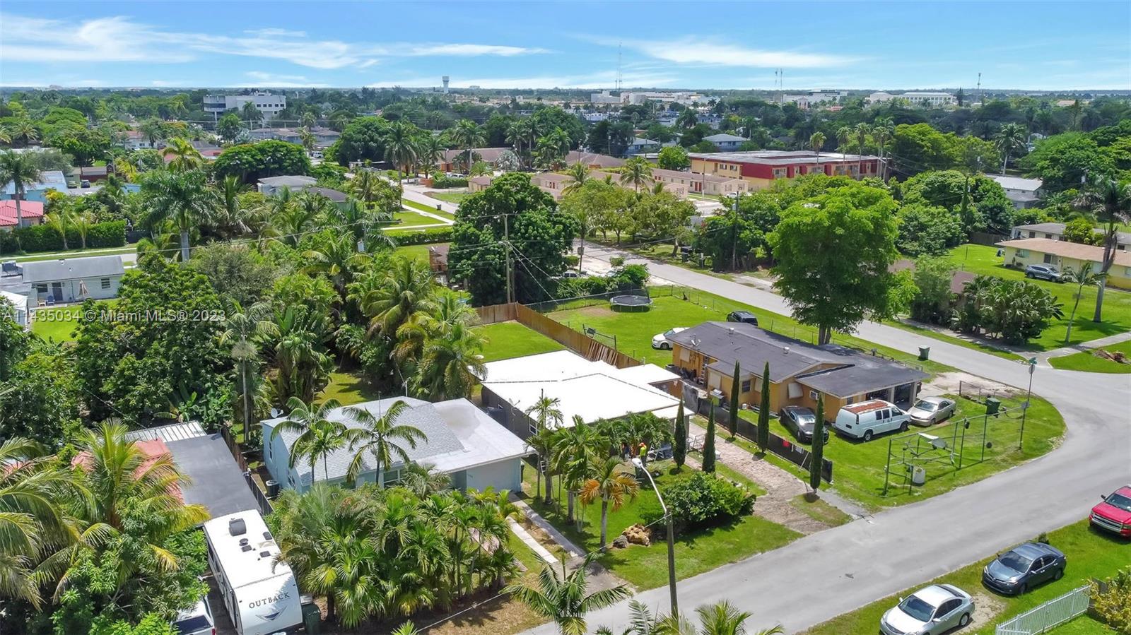 1023 Northwest 3rd Avenue Homestead, FL 33030 - Photo 27 of 32 an aerial view of residential houses with outdoor space and trees all around