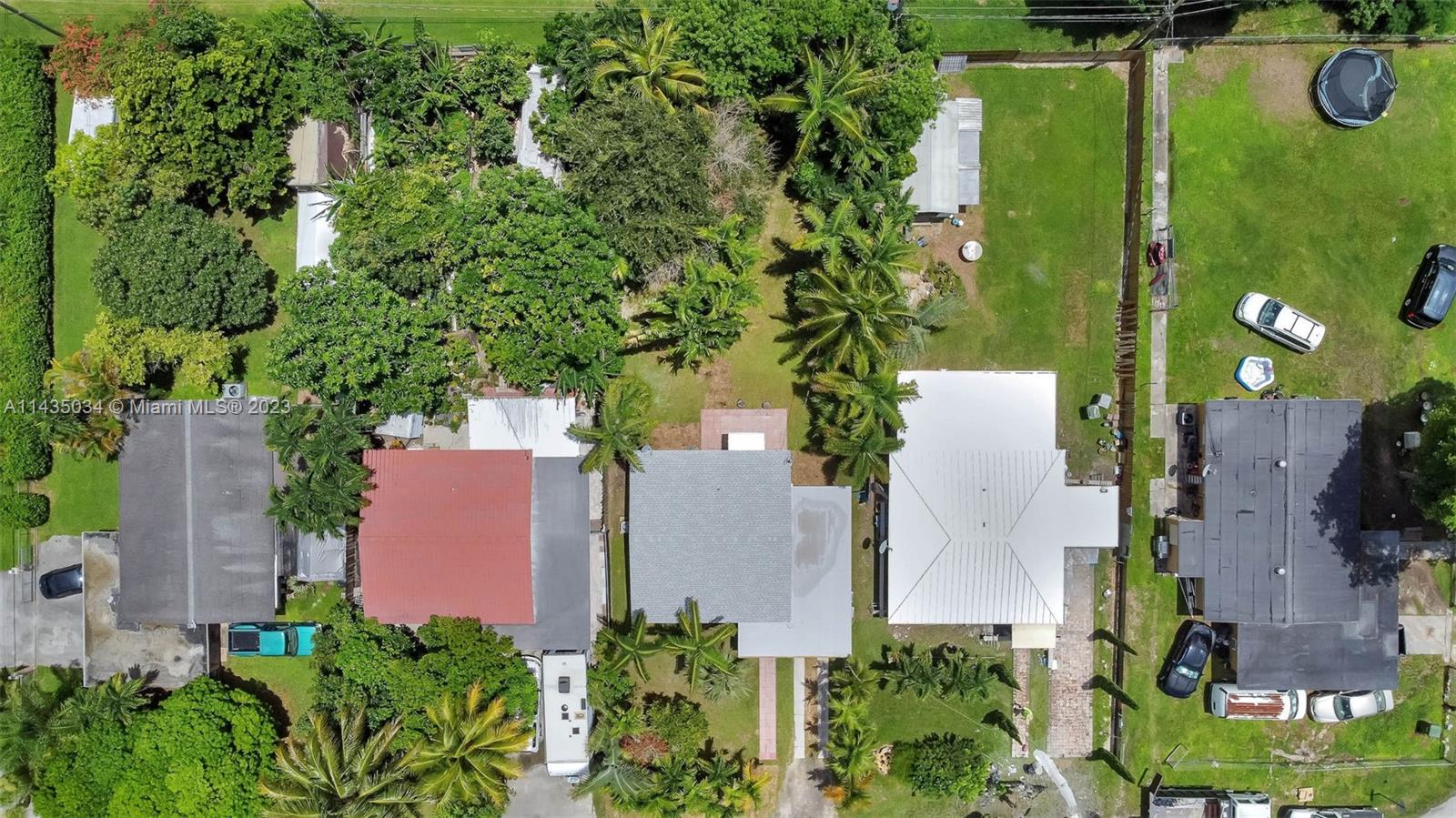1023 Northwest 3rd Avenue Homestead, FL 33030 - Photo 30 of 32 an aerial view of a house with a yard and garden