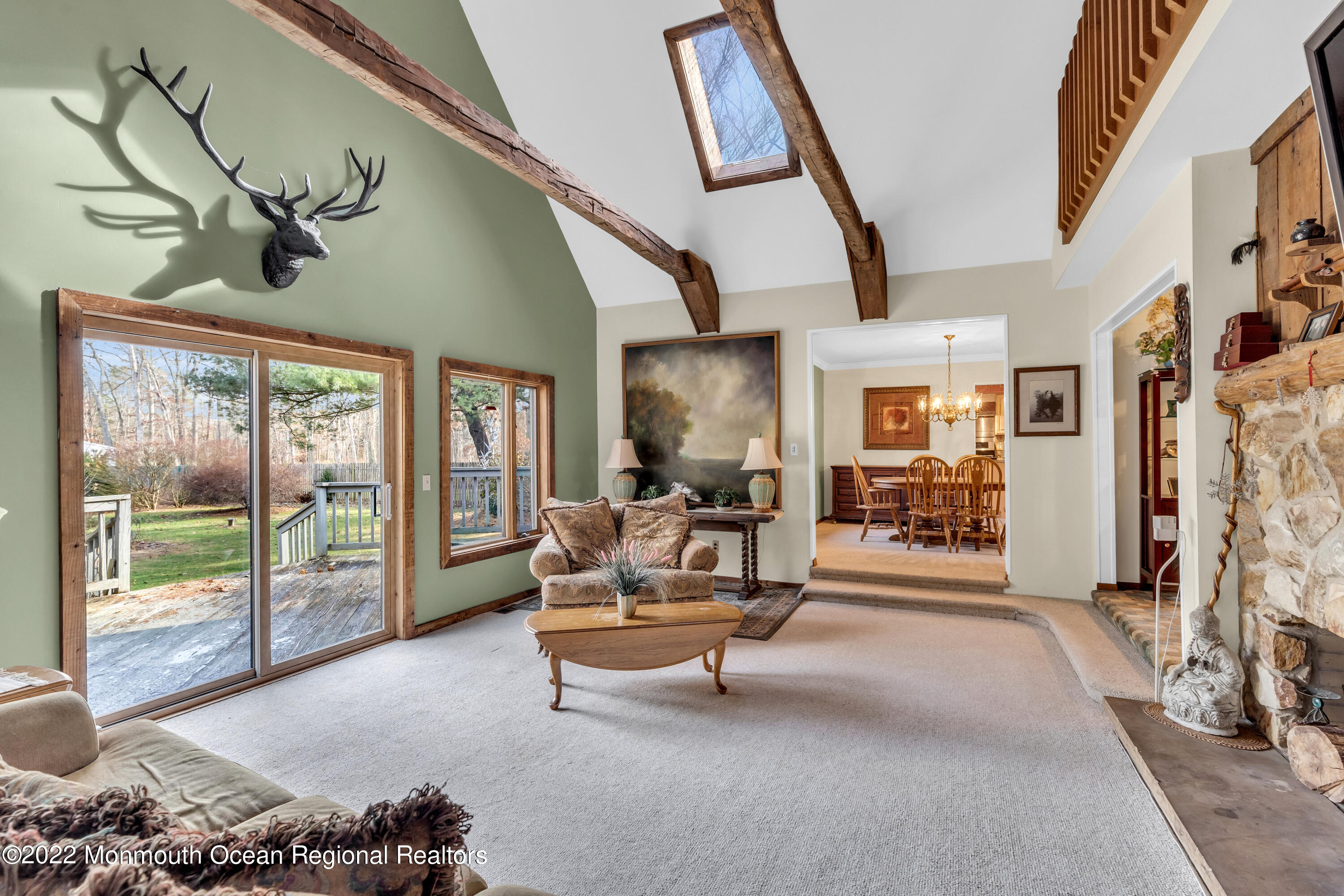 39 Johnson Lane Jackson, NJ 08527 - Photo 11 of 47 a living room with furniture and a floor to ceiling window