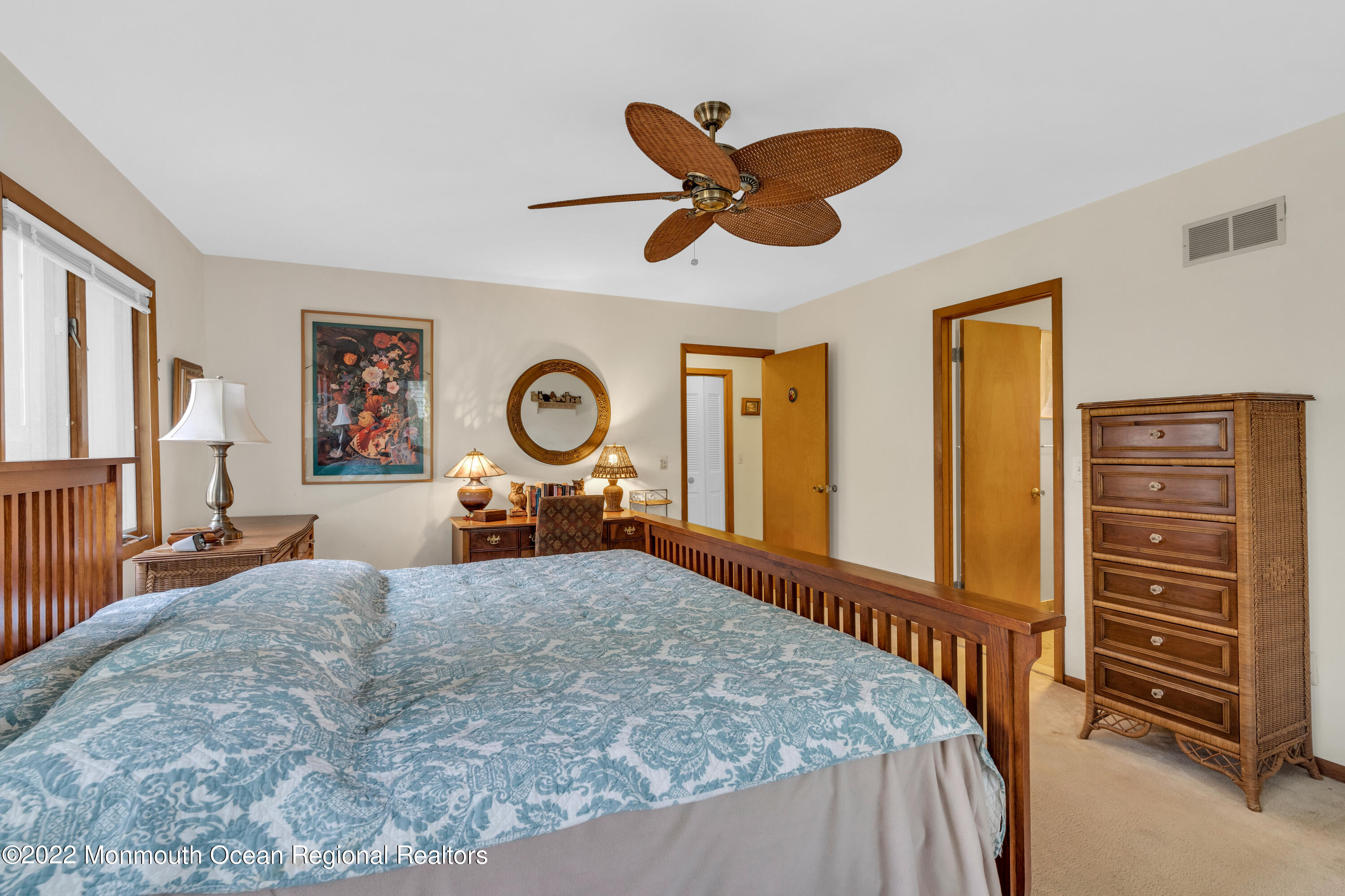 39 Johnson Lane Jackson, NJ 08527 - Photo 32 of 47 a bedroom with a bed and a chandelier