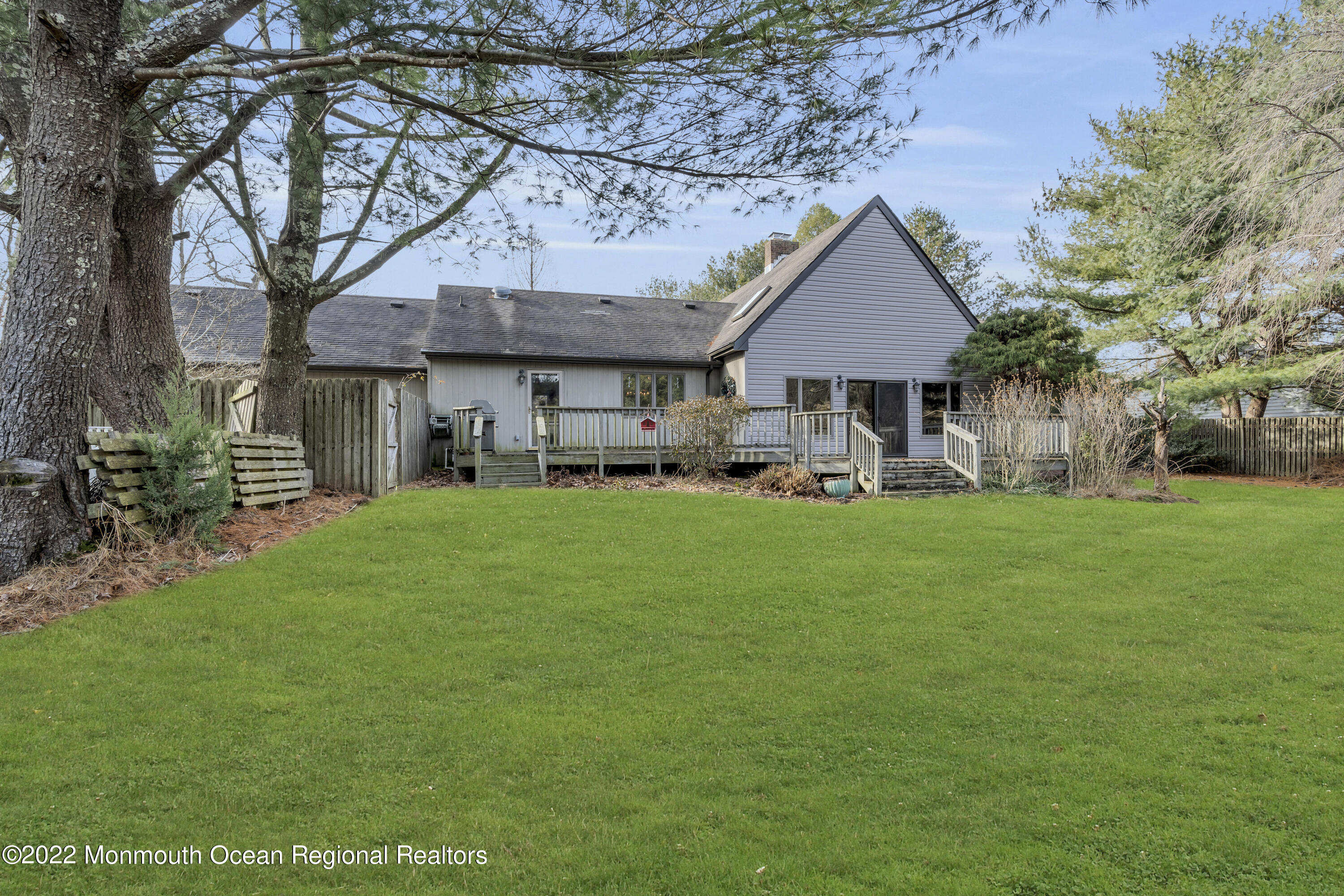 39 Johnson Lane Jackson, NJ 08527 - Photo 35 of 47 a front view of a house with a yard and trees