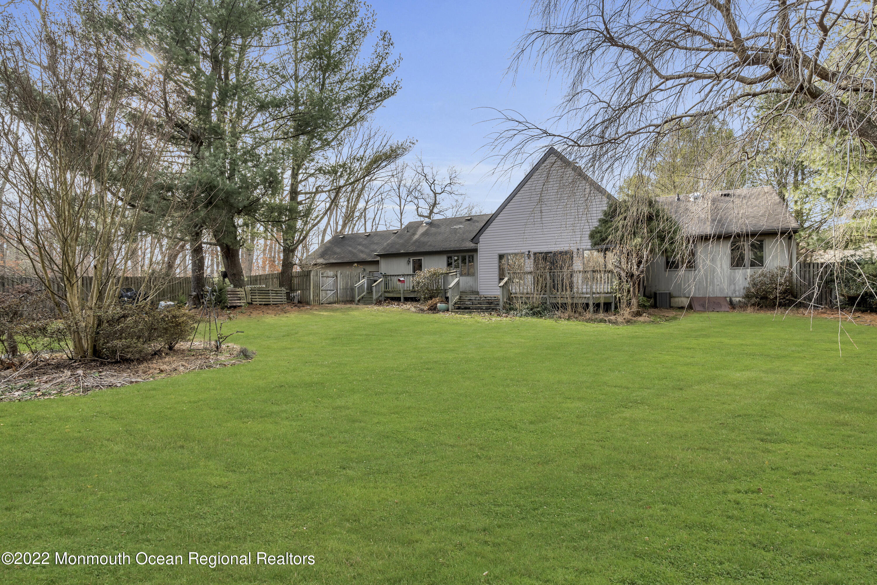 39 Johnson Lane Jackson, NJ 08527 - Photo 36 of 47 a front view of house with yard and green space