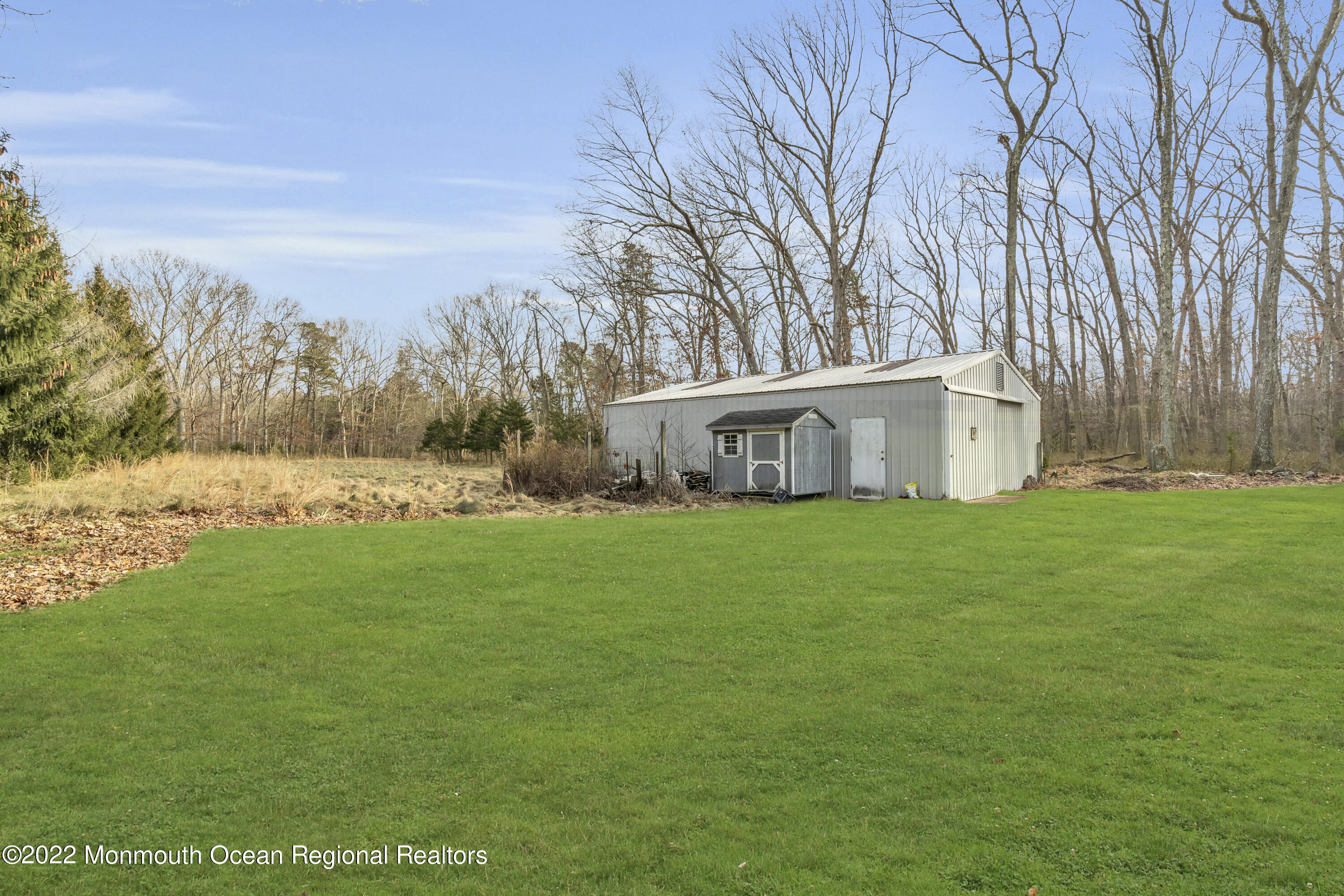 39 Johnson Lane Jackson, NJ 08527 - Photo 45 of 47 a front view of house with yard and trees