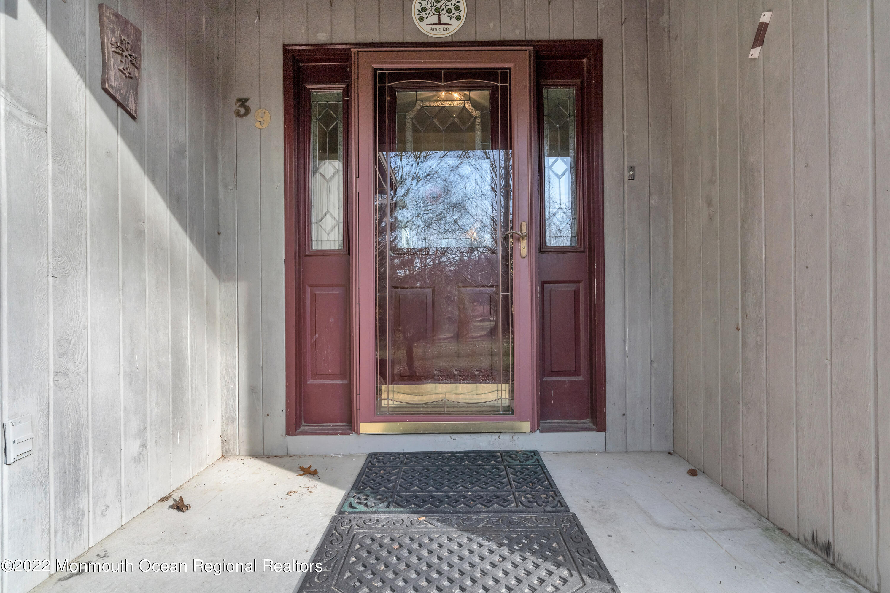 39 Johnson Lane Jackson, NJ 08527 - Photo 5 of 47 a view of a wooden door a living room and stairs