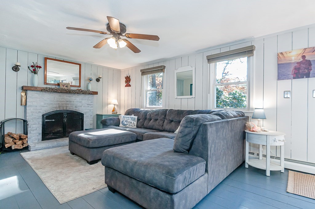133 High Street Rochester, MA 02770 - Photo 12 of 38 a living room with furniture and a fireplace