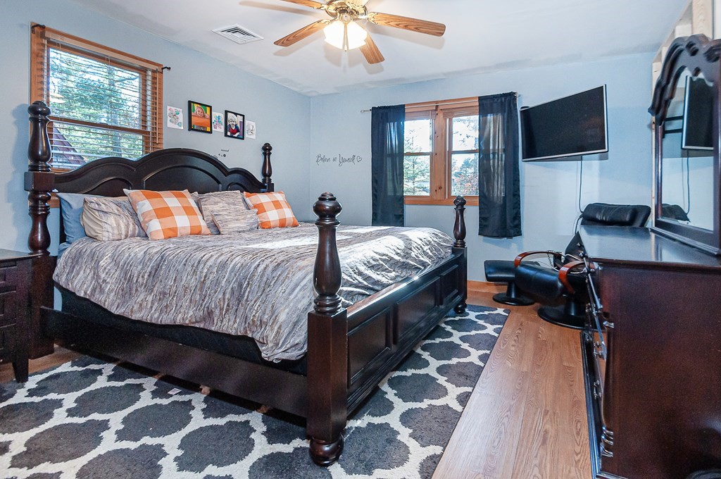 133 High Street Rochester, MA 02770 - Photo 27 of 38 a bedroom with double bed and a flat tv screen on dresser