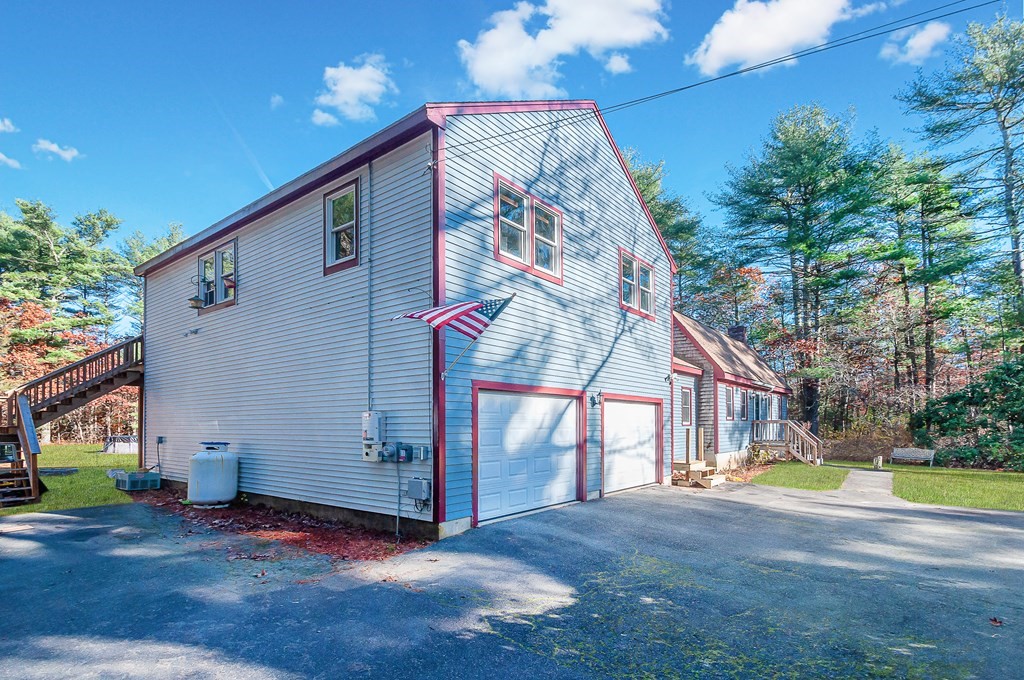 133 High Street Rochester, MA 02770 - Photo 3 of 38 a view of a house with a yard and a patio
