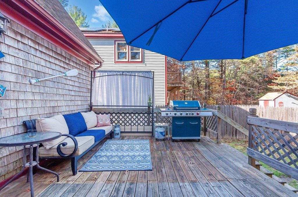 133 High Street Rochester, MA 02770 - Photo 31 of 38 a wooden floor with a table and chairs