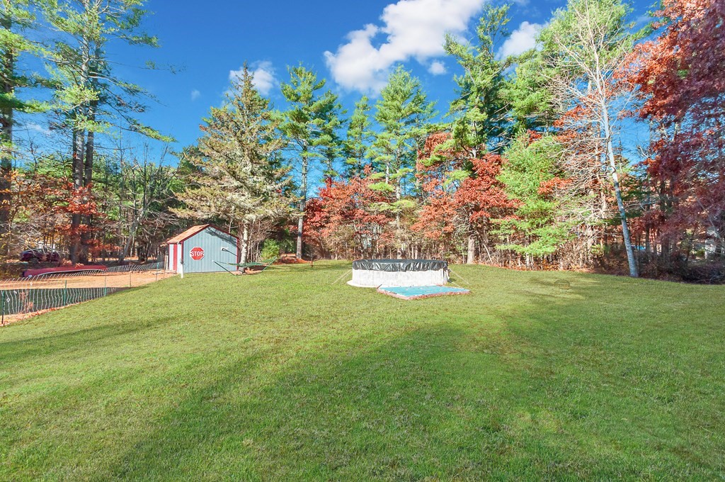 133 High Street Rochester, MA 02770 - Photo 6 of 38 a view of outdoor space with garden and trees
