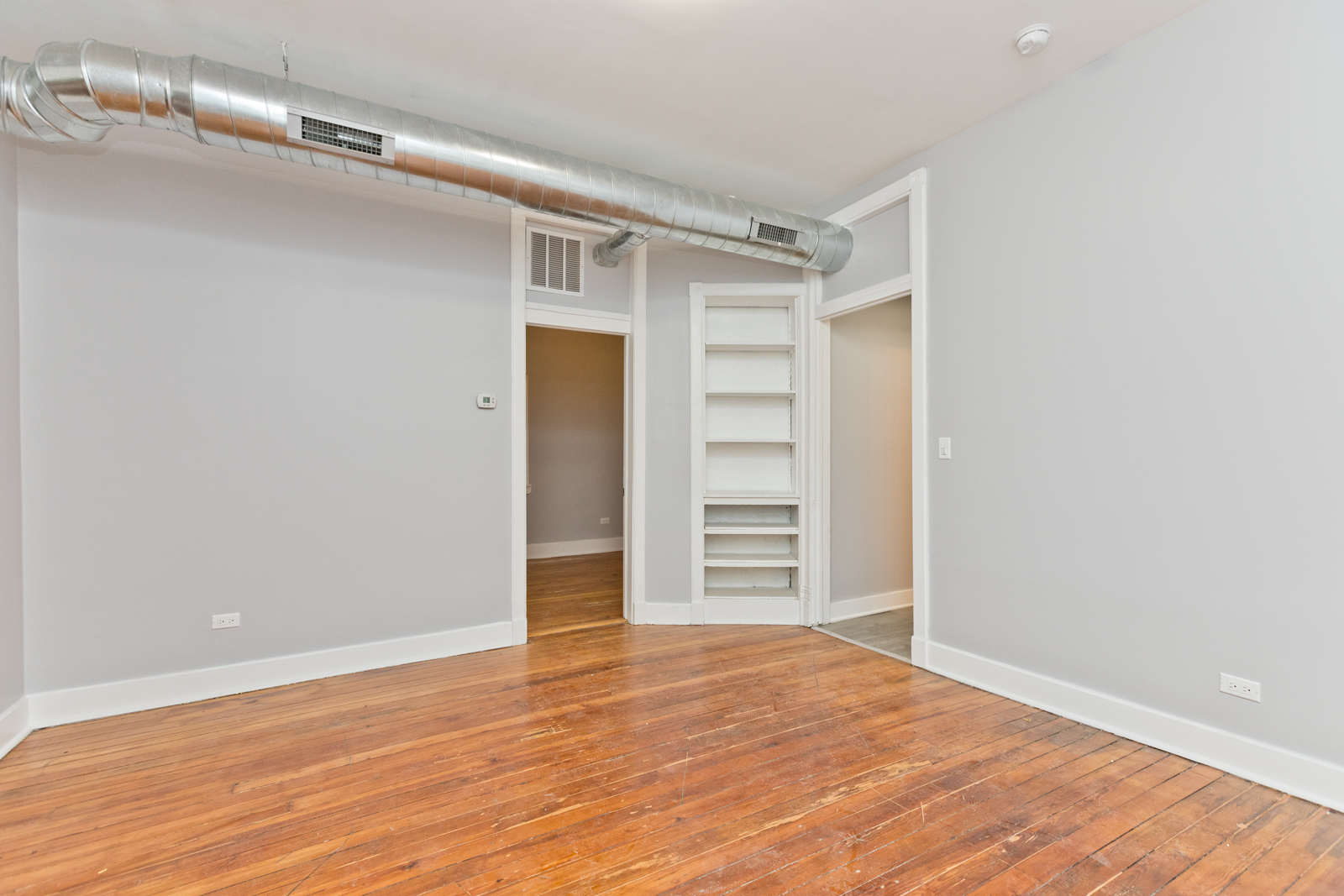 1300 West Addison Street, Unit 1 Chicago, IL 60613 - Photo 7 of 14 a view of walk in closet with empty racks