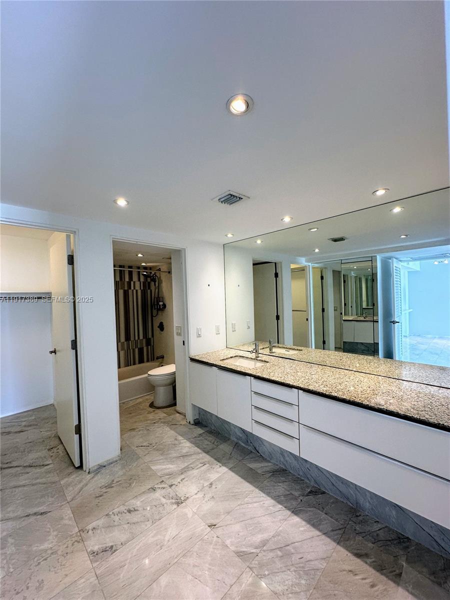 2350 Northeast 135th Street, Unit 1501 North Miami, FL 33181 - Photo 5 of 13 a large living room with a large window