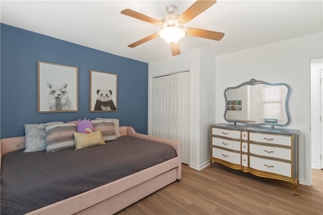 2900 Highway 187 Anderson, SC 29626 - Photo 27 of 41 Well-lit room with wood flooring, offering a ceiling fan and ample closet storage.