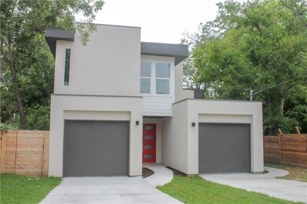 a front view of a house with garage