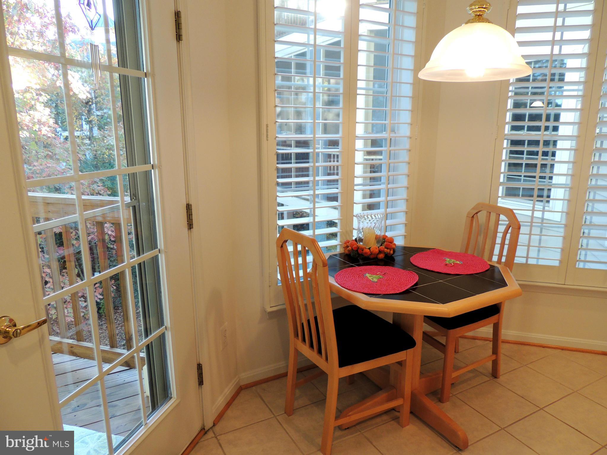 722 Runabout Loop, Unit 722 Solomons, MD 20688 - Photo 13 of 30 a view of a dining room with furniture and a window