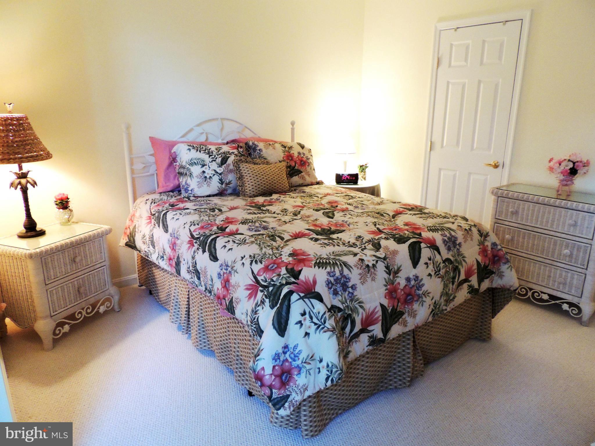 722 Runabout Loop, Unit 722 Solomons, MD 20688 - Photo 19 of 30 a bedroom with a bed and a window