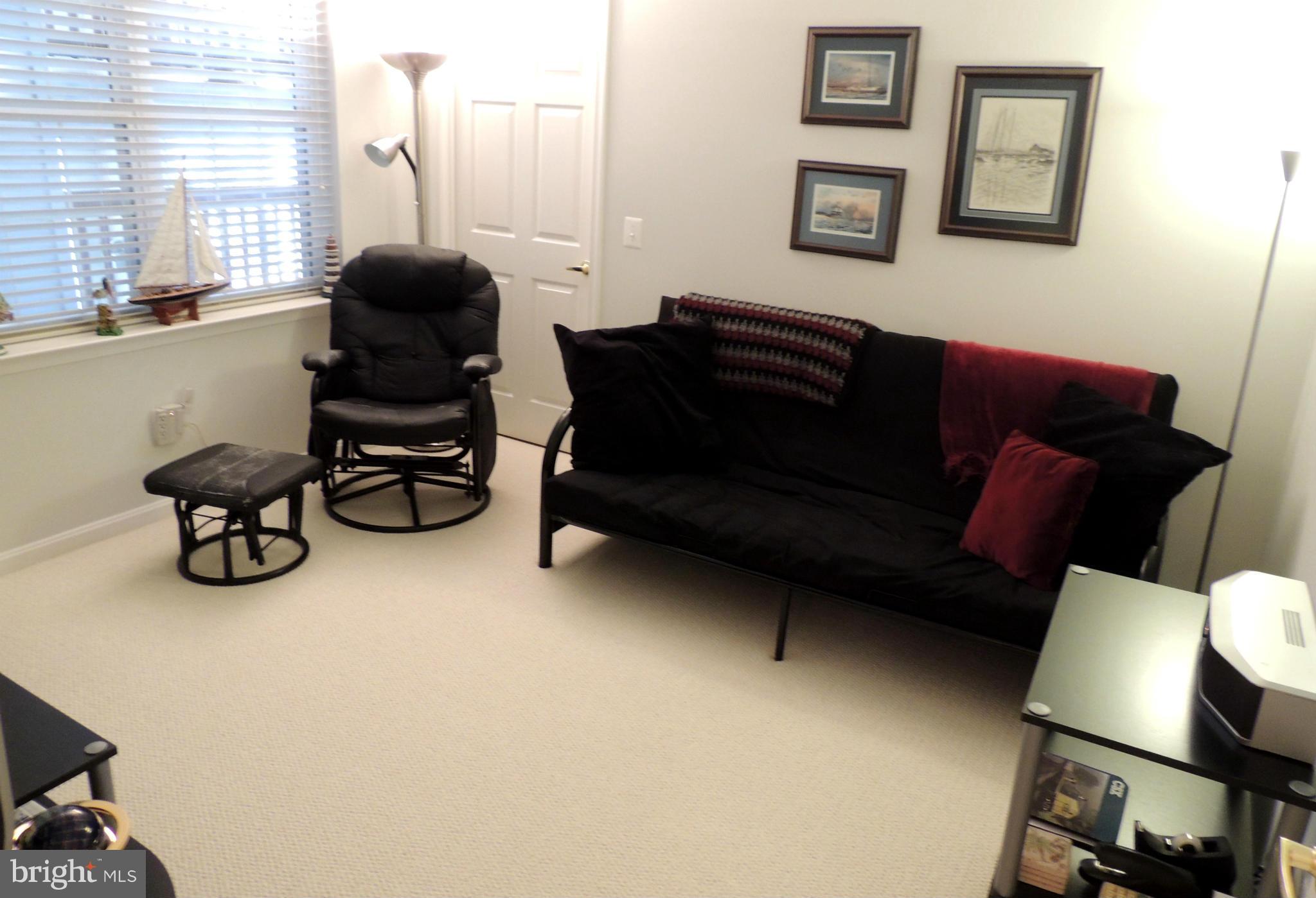 722 Runabout Loop, Unit 722 Solomons, MD 20688 - Photo 20 of 30 a living room with furniture and a window