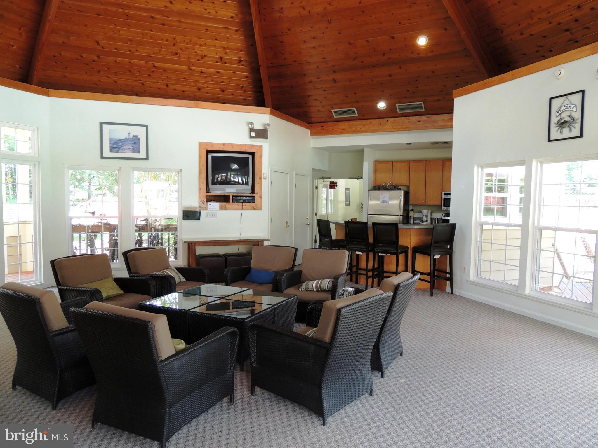 722 Runabout Loop, Unit 722 Solomons, MD 20688 - Photo 24 of 30 a living room with furniture and a window