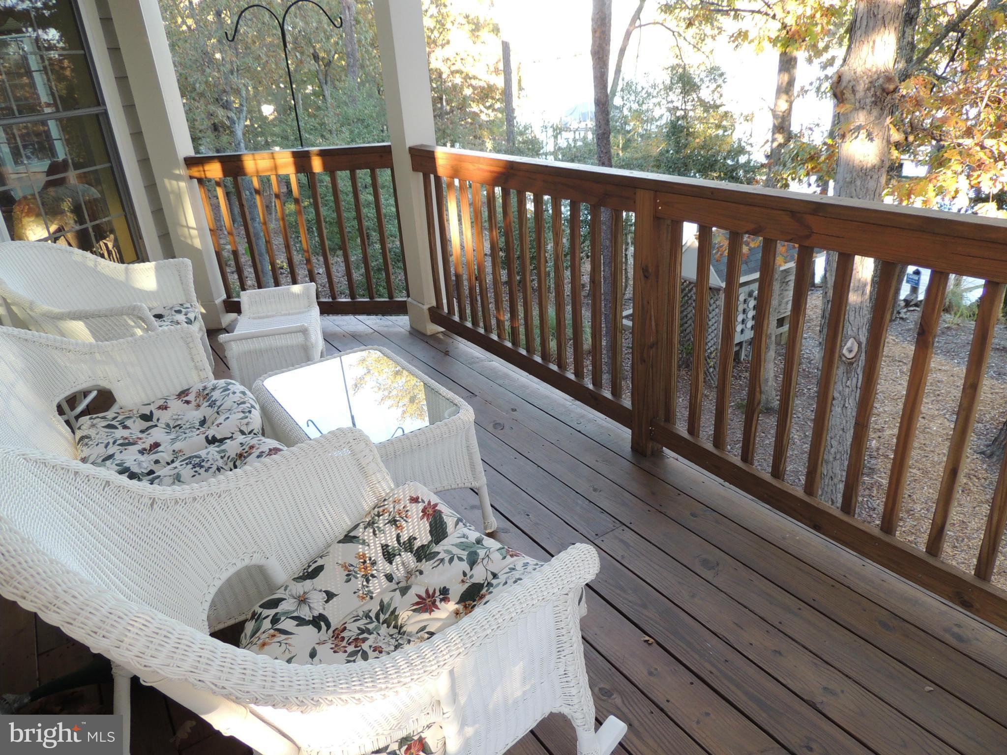 722 Runabout Loop, Unit 722 Solomons, MD 20688 - Photo 6 of 30 a view of a balcony with wooden floor