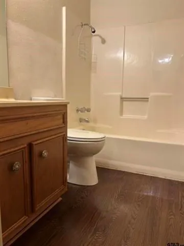 a bathroom with a toilet a sink and a bathtub
