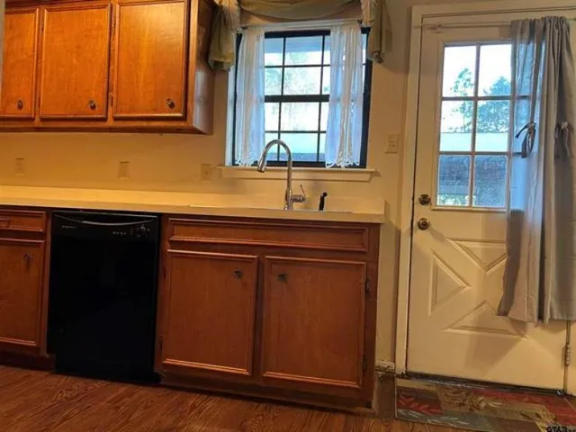 a kitchen with a sink and a window