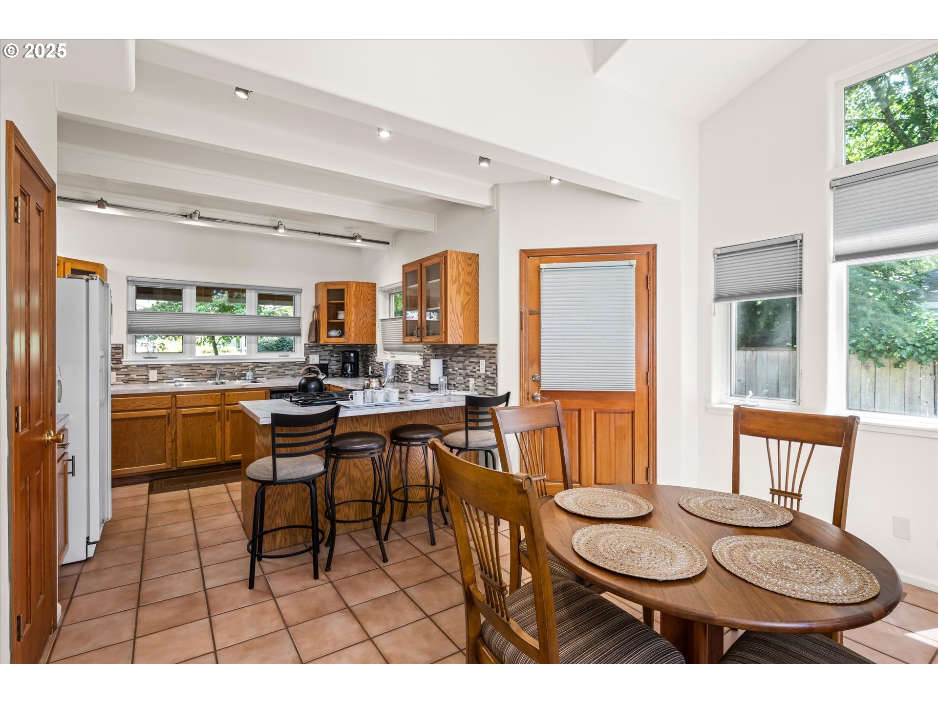 820 Park Terrace Eugene, OR 97404 - Photo 11 of 44 a dining room with furniture and a floor to ceiling window