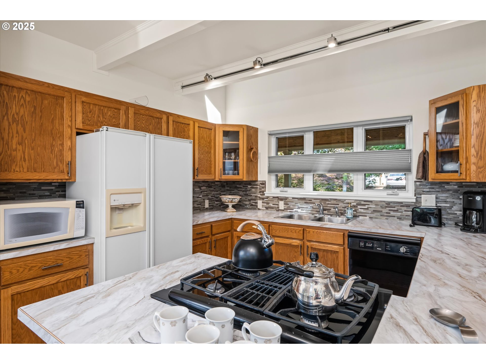820 Park Terrace Eugene, OR 97404 - Photo 16 of 44 a kitchen with stainless steel appliances granite countertop a stove refrigerator and cabinets