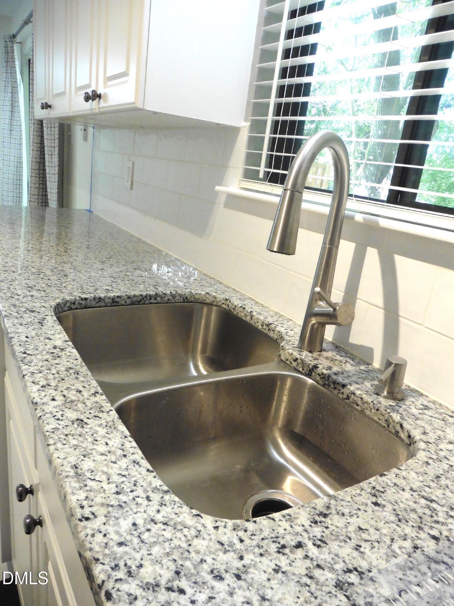 4257 Lake Ridge Drive Raleigh, NC 27604 - Photo 14 of 19 a close view of sink and tap