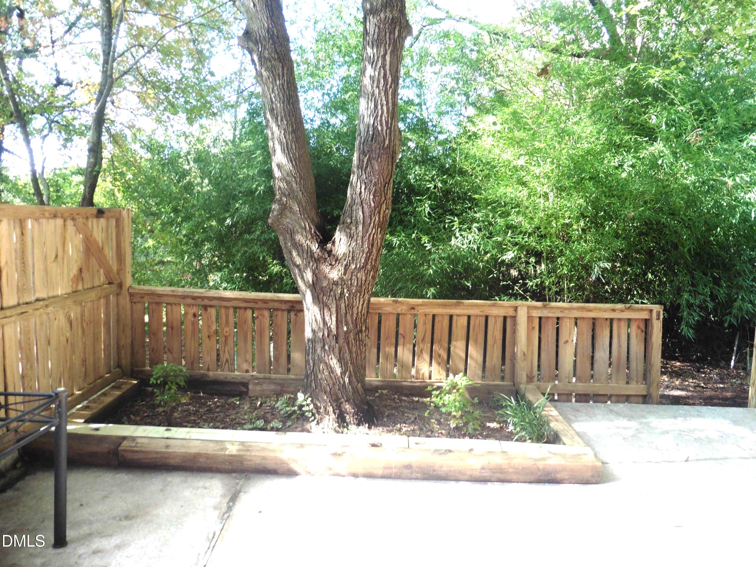 4257 Lake Ridge Drive Raleigh, NC 27604 - Photo 15 of 19 a view of a bench in a yard