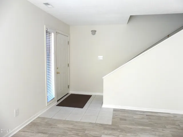 a view of a livingroom with furniture and wooden floor