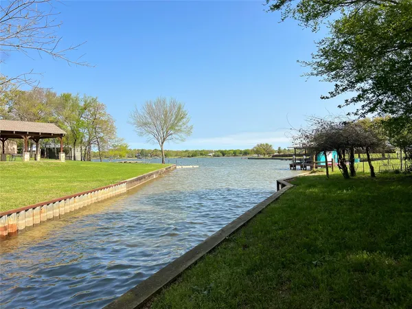 a view of a lake with a big yard