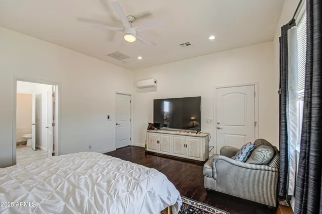 a bedroom with a bed and a lamp