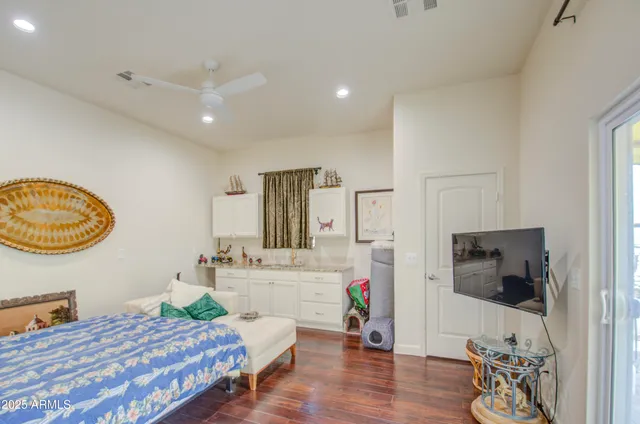 a view of a patio with a table and chairs