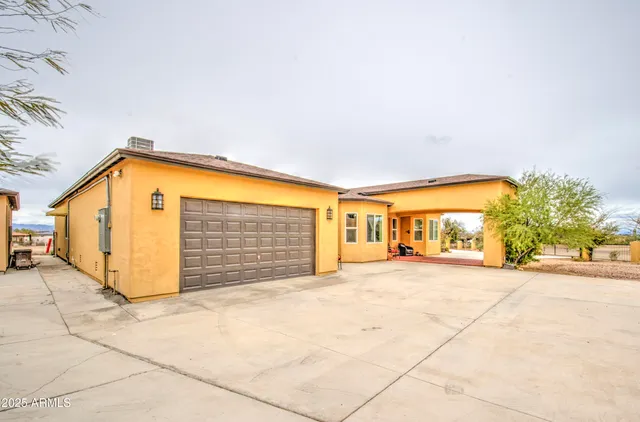 a living room with furniture flat screen tv and wooden floor