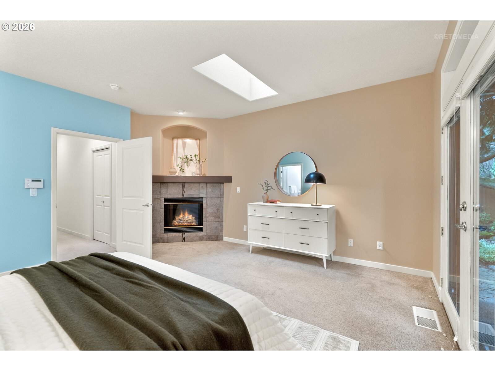 2625 Southwest 75th Terrace Portland, OR 97225 - Photo 16 of 45 a bedroom with a bed and a fireplace