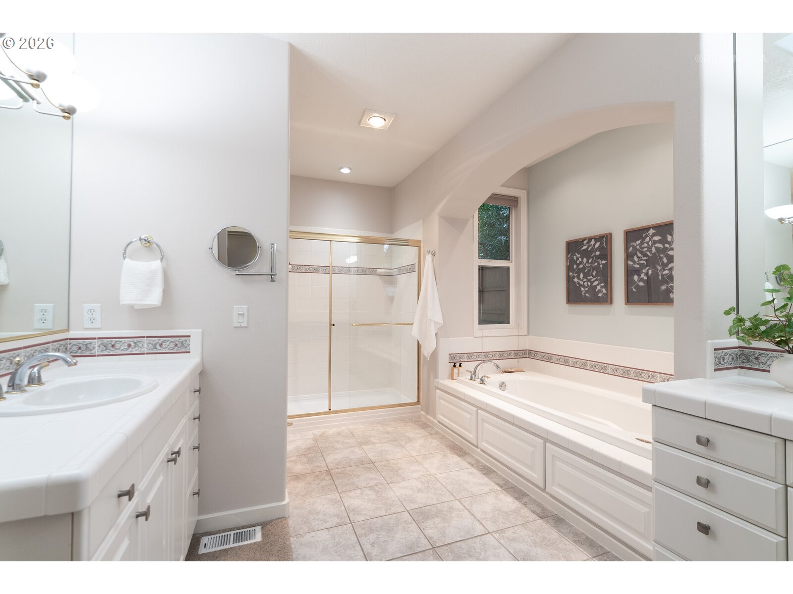 2625 Southwest 75th Terrace Portland, OR 97225 - Photo 17 of 45 a spacious bathroom with a tub sink and mirror
