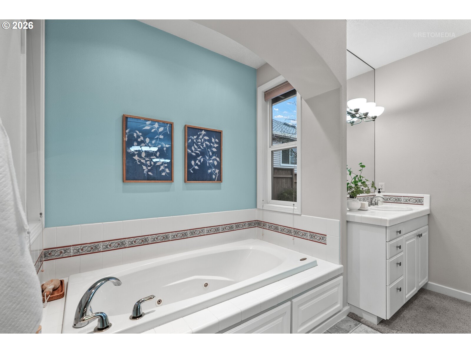 2625 Southwest 75th Terrace Portland, OR 97225 - Photo 18 of 45 a bathroom with a tub a sink and mirror