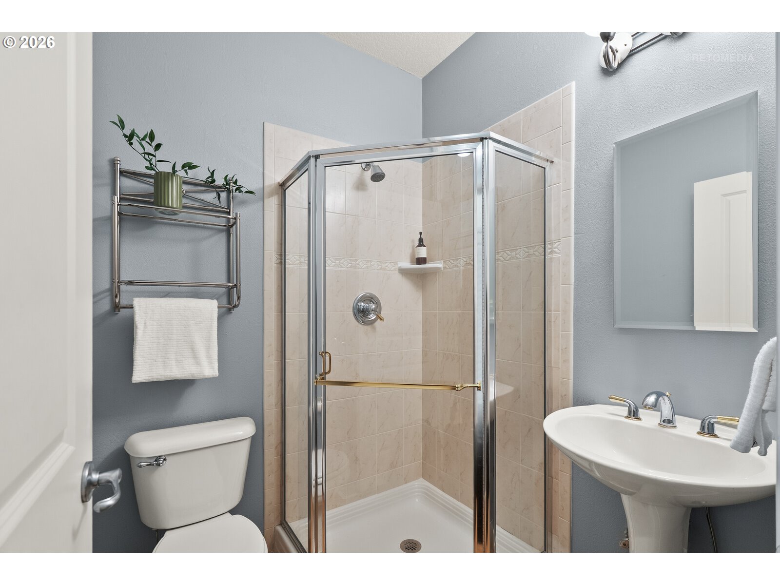 2625 Southwest 75th Terrace Portland, OR 97225 - Photo 23 of 45 a bathroom with a sink a toilet and shower