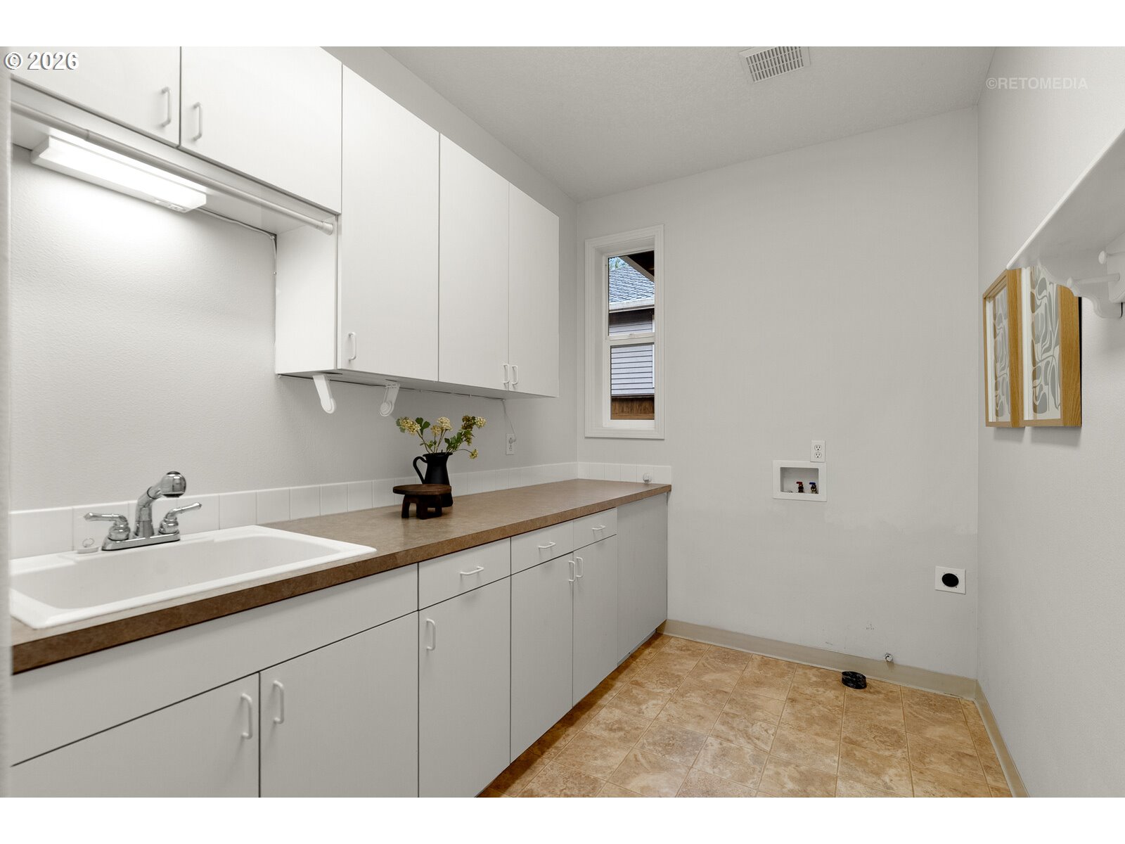 2625 Southwest 75th Terrace Portland, OR 97225 - Photo 24 of 45 a kitchen with a sink and cabinets