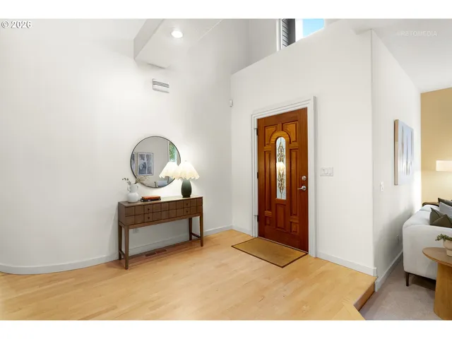 a bedroom with a bed and a table