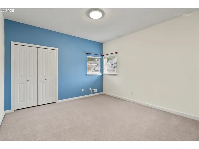 a bathroom with a sink vanity granite tub shower and a mirror