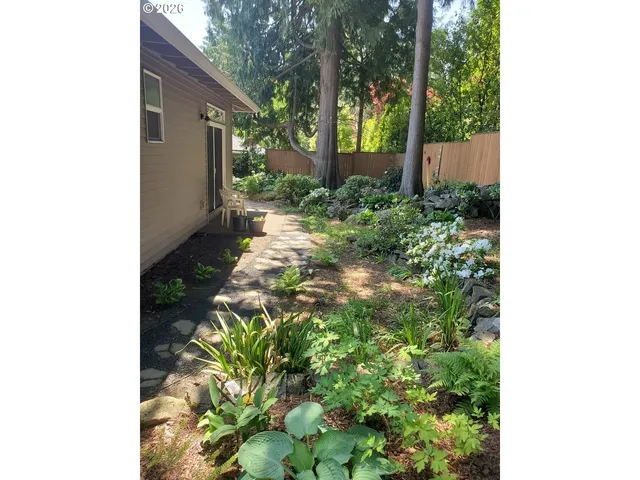 a backyard of a house with lots of green space