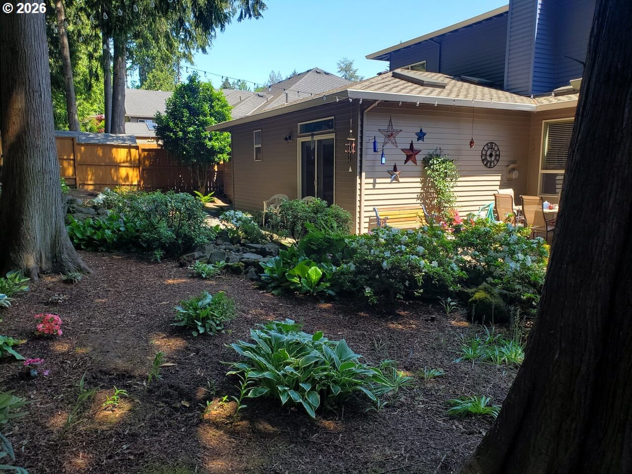2625 Southwest 75th Terrace Portland, OR 97225 - Photo 40 of 45 a front view of a house with garden
