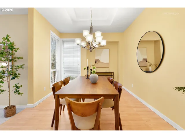 a dining room with a table and chairs