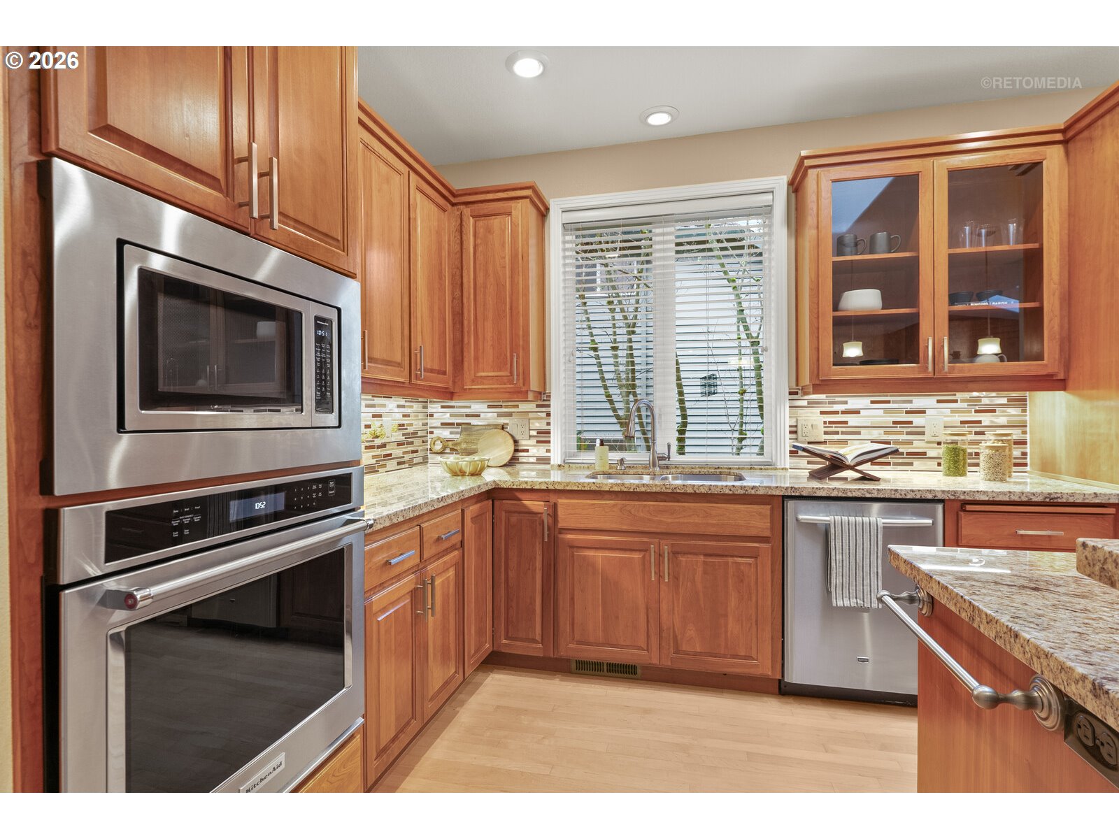 2625 Southwest 75th Terrace Portland, OR 97225 - Photo 8 of 45 a kitchen with stainless steel appliances granite countertop a stove microwave and sink