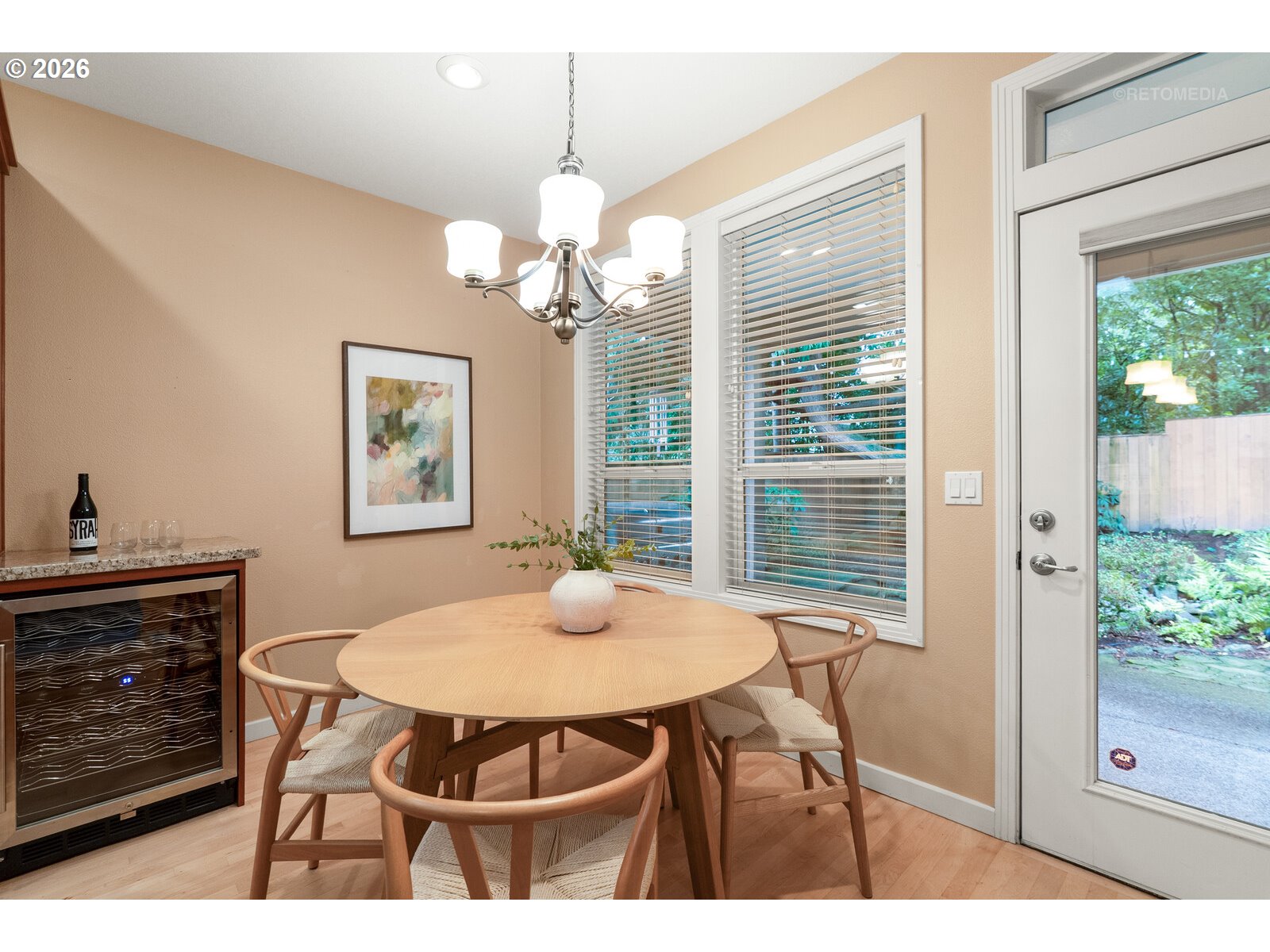 2625 Southwest 75th Terrace Portland, OR 97225 - Photo 10 of 45 a view of a dining room with furniture and a chandelier