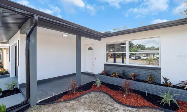a room with wooden floor and furniture